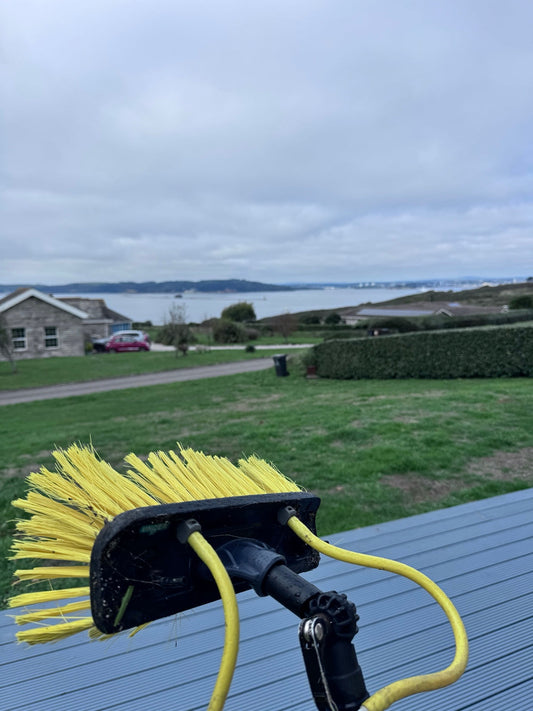Window cleaning brush overlooking Heybrook Bay on Tuesday’s round